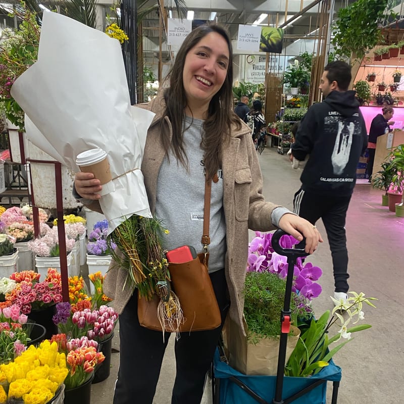 Nicole holding fresh flowers at the flower market