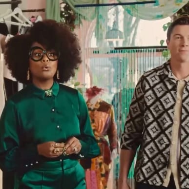 Two shop employees standing in a colorful boutique interior