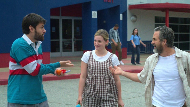 Hal, Harper and their dad talking outside a school building