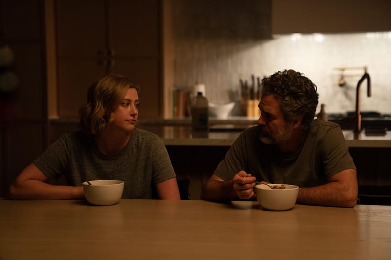 Late-night kitchen scene, two characters eating cereal at the island
